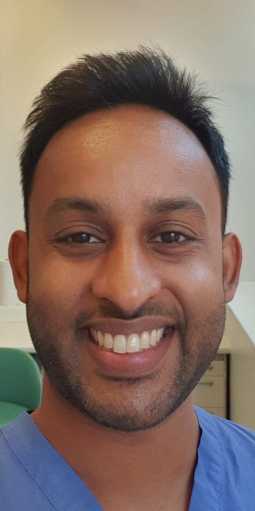 Bevan Fellow Sagar Shah in blue scrubs